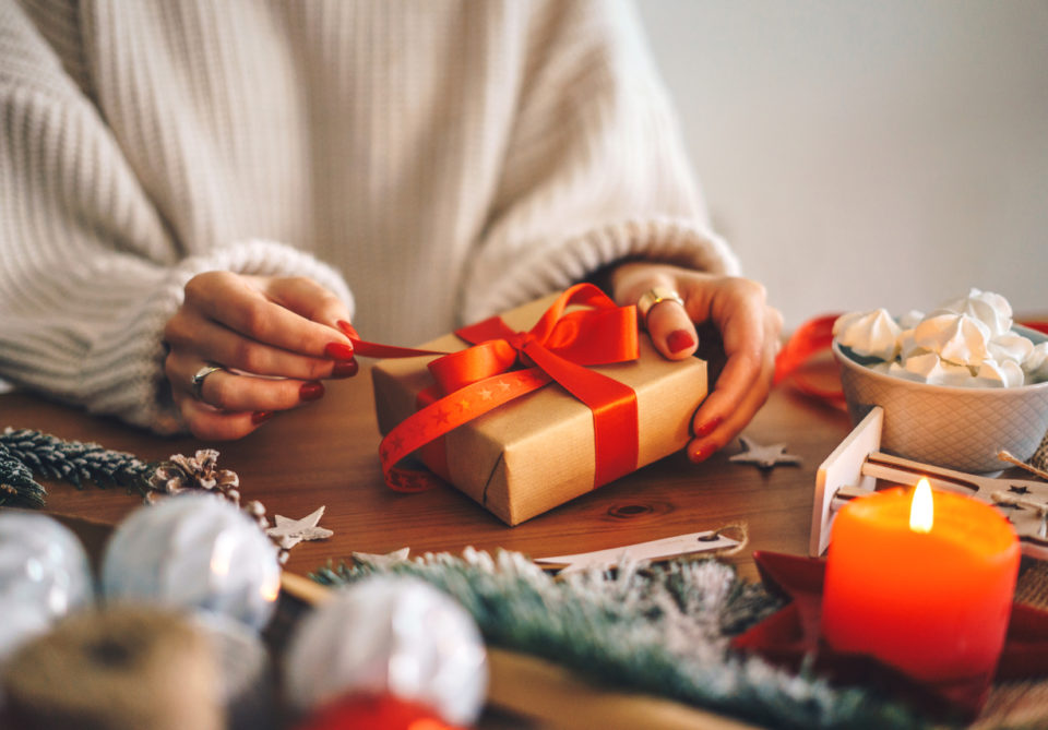 Woman wrapping Christmas gifts