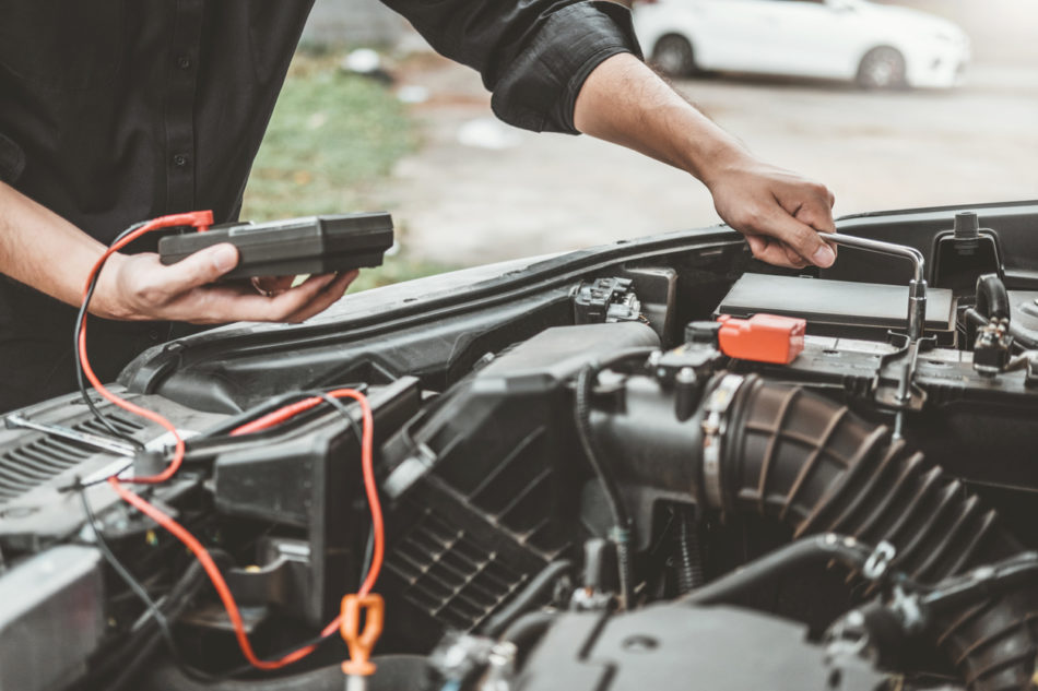 Auto mechanic working in garage