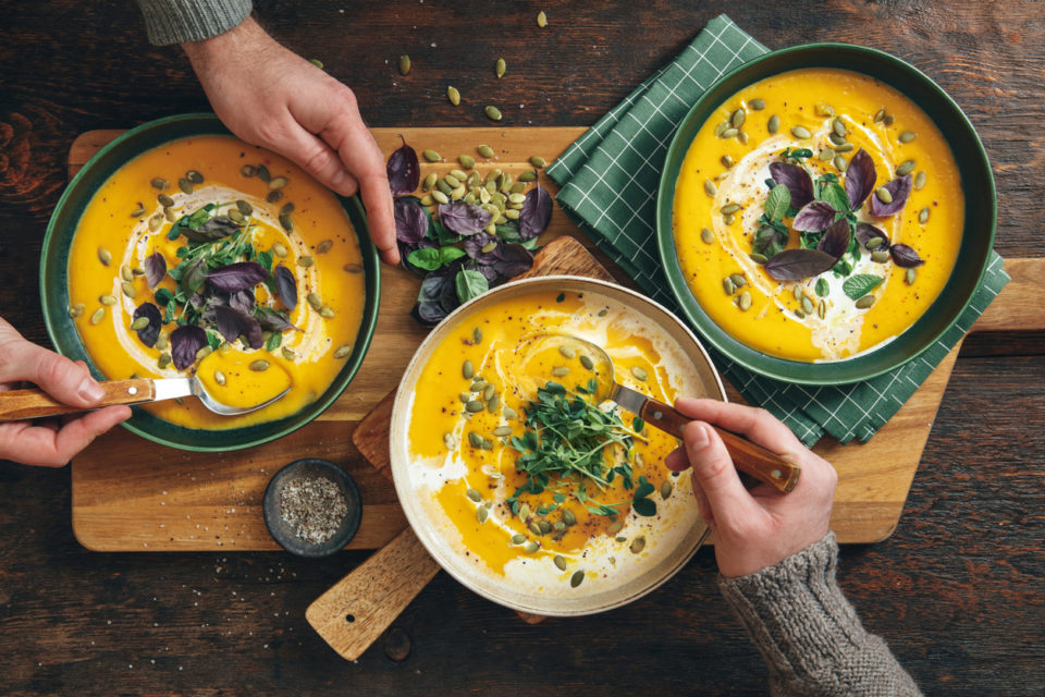 Men eating Vegan Creamy Roasted Pumpkin Soup