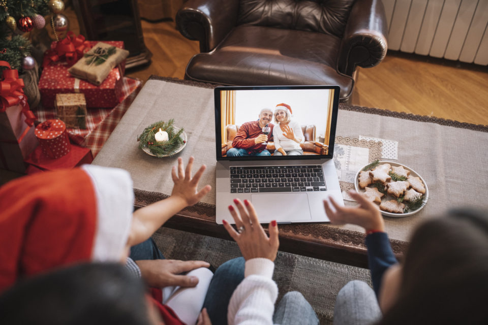 Family in Christmas video call.