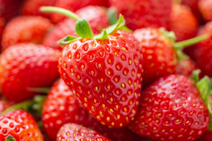 Fresh organic red ripe Strawberry fruit background closeup