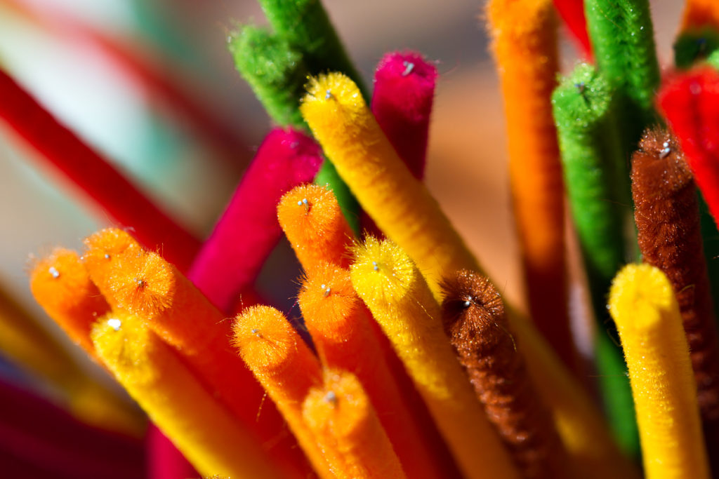 Brightly colored pipe cleaners at various angles.