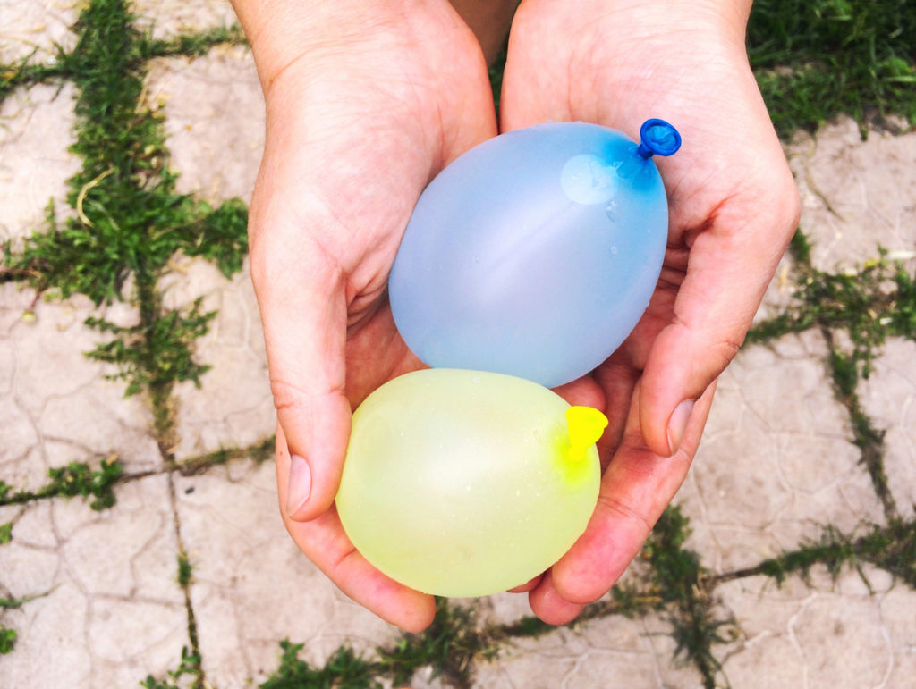 Water bombs in woman hands