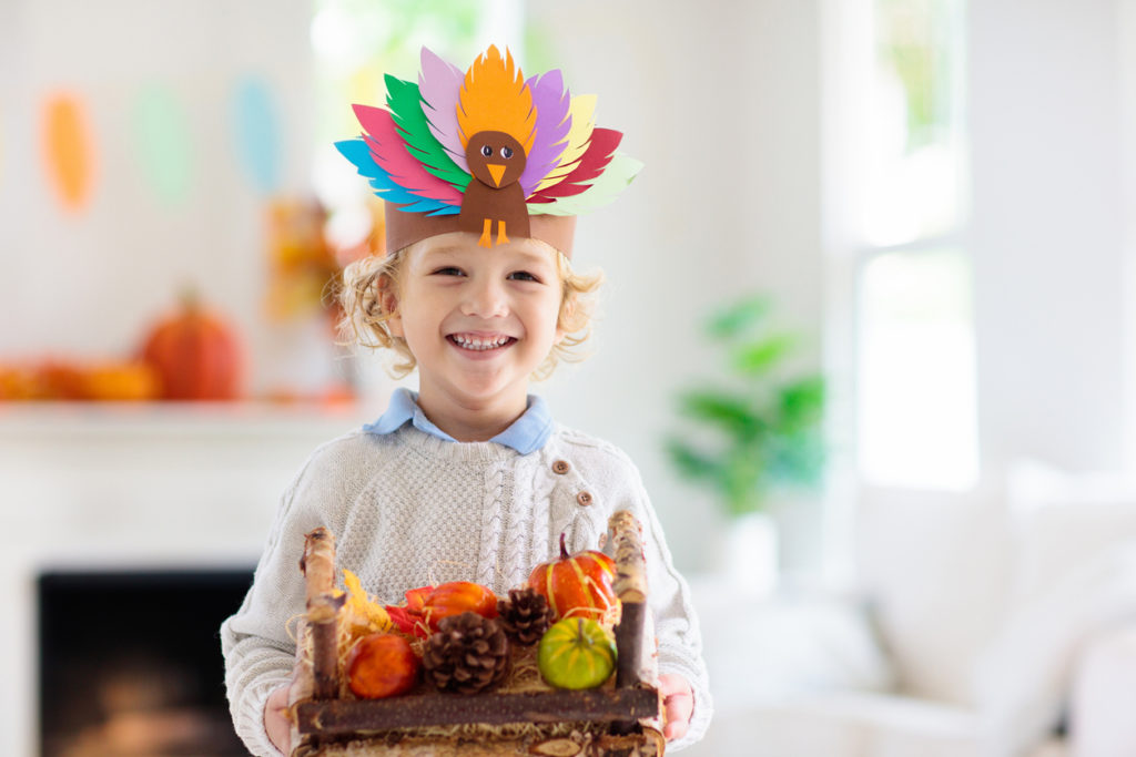 Kid with autumn turkey hat.