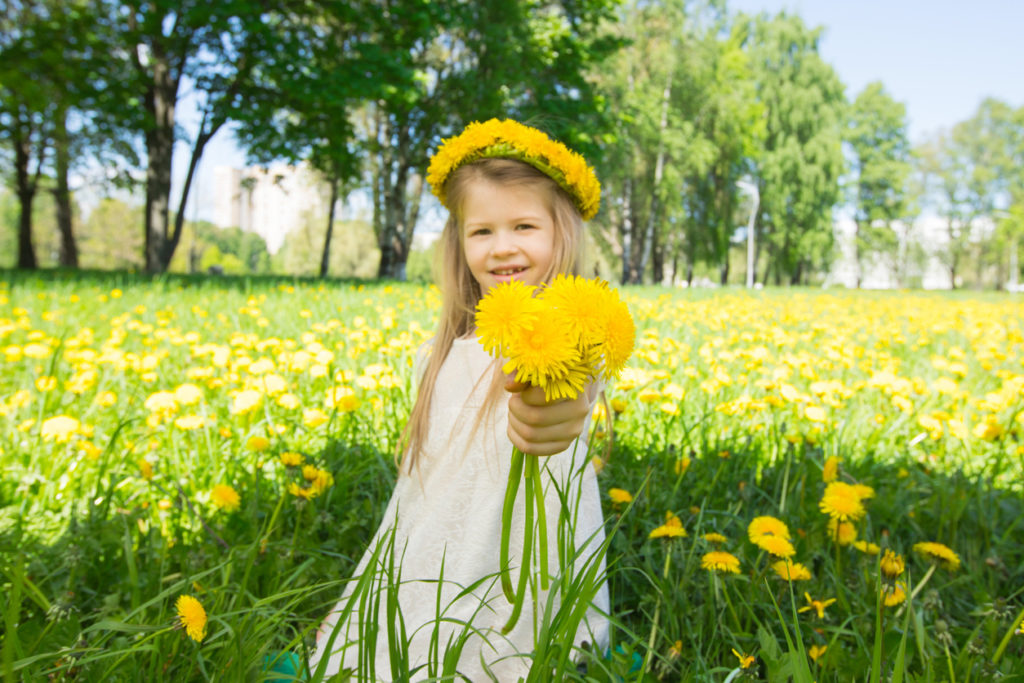 Girl with floral head wreath and bunch