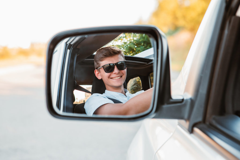 handsome young man driving