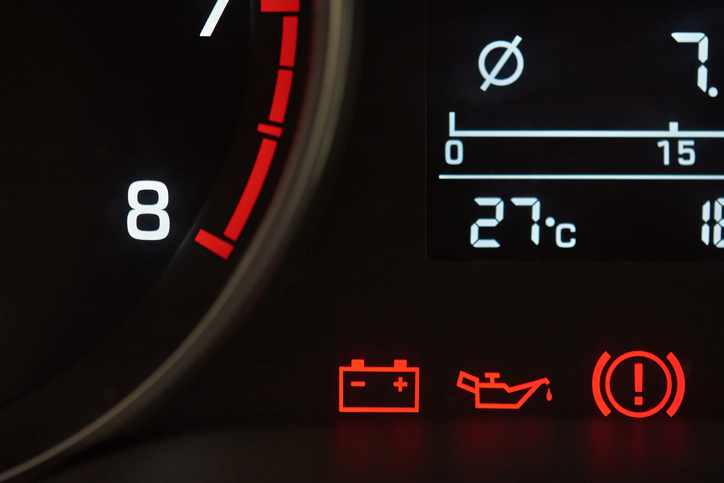 Error icons on car dashboard close-up